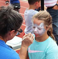 Girl getting her face painted