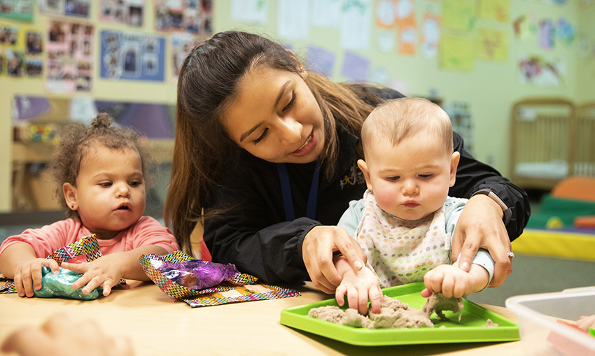 Why early childhood education matters - teacher with two children