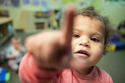Why early childhood education matters - tot pointing finger