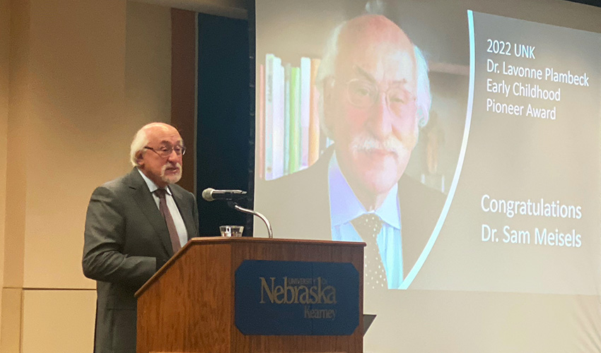 Samuel J. Meisels, the founding executive director of the Buffett Early Childhood Institute, receives the Plambeck Early Childhood Pioneer Award at the University of Nebraska at Kearney-Community Early Childhood Conference.