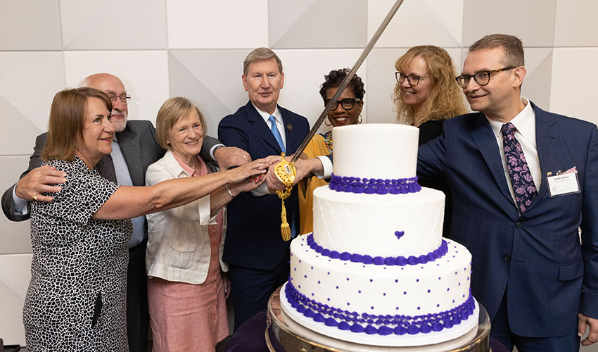 Deb Love, Samuel Meisels, Jessie Rasmussen, Ted Carter, Dannette Smith, Kristi Reinch, and Walter Gilliam cut the Buffett Institute's 10-year birthday cake.