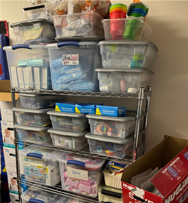 The inside of a diaper bank with baby supplies on shelving units