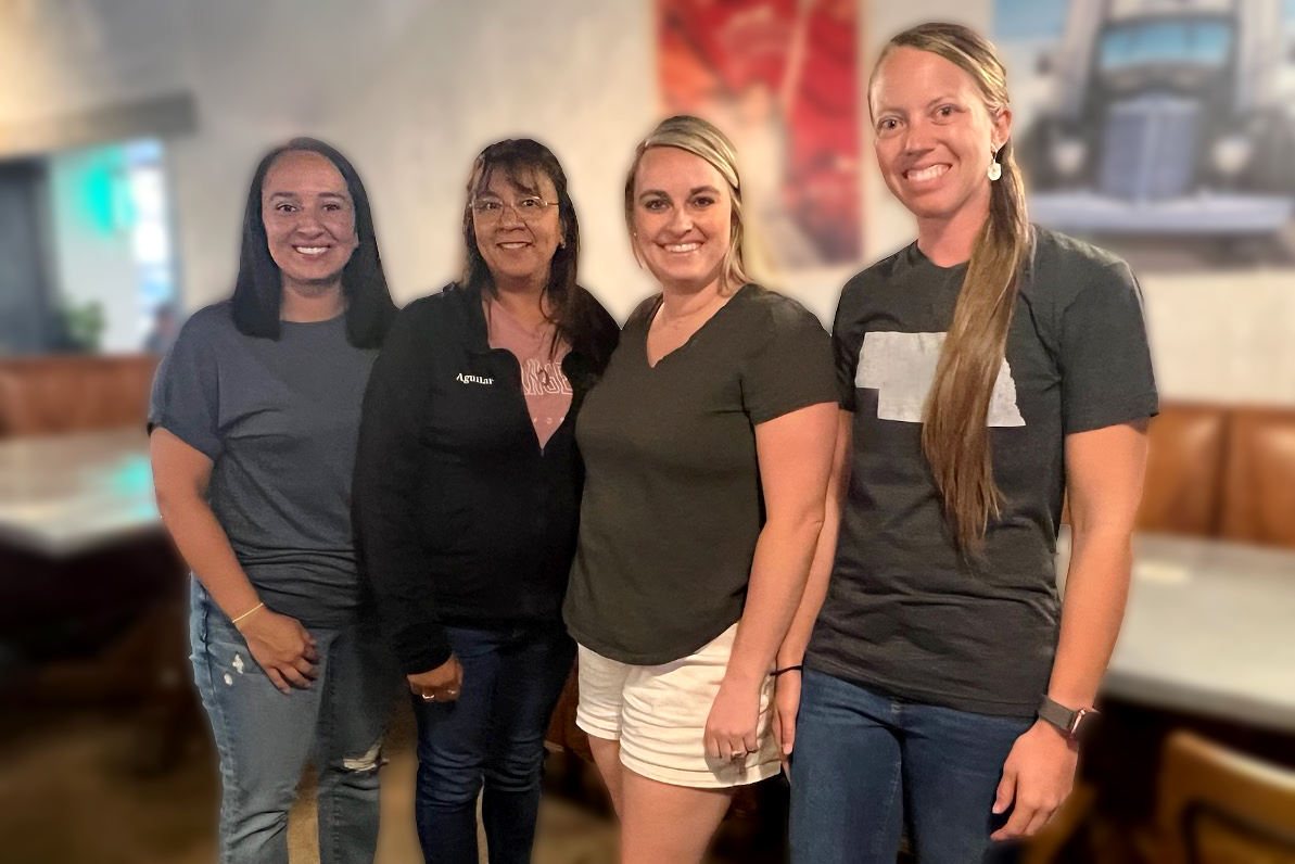 Four women standing 