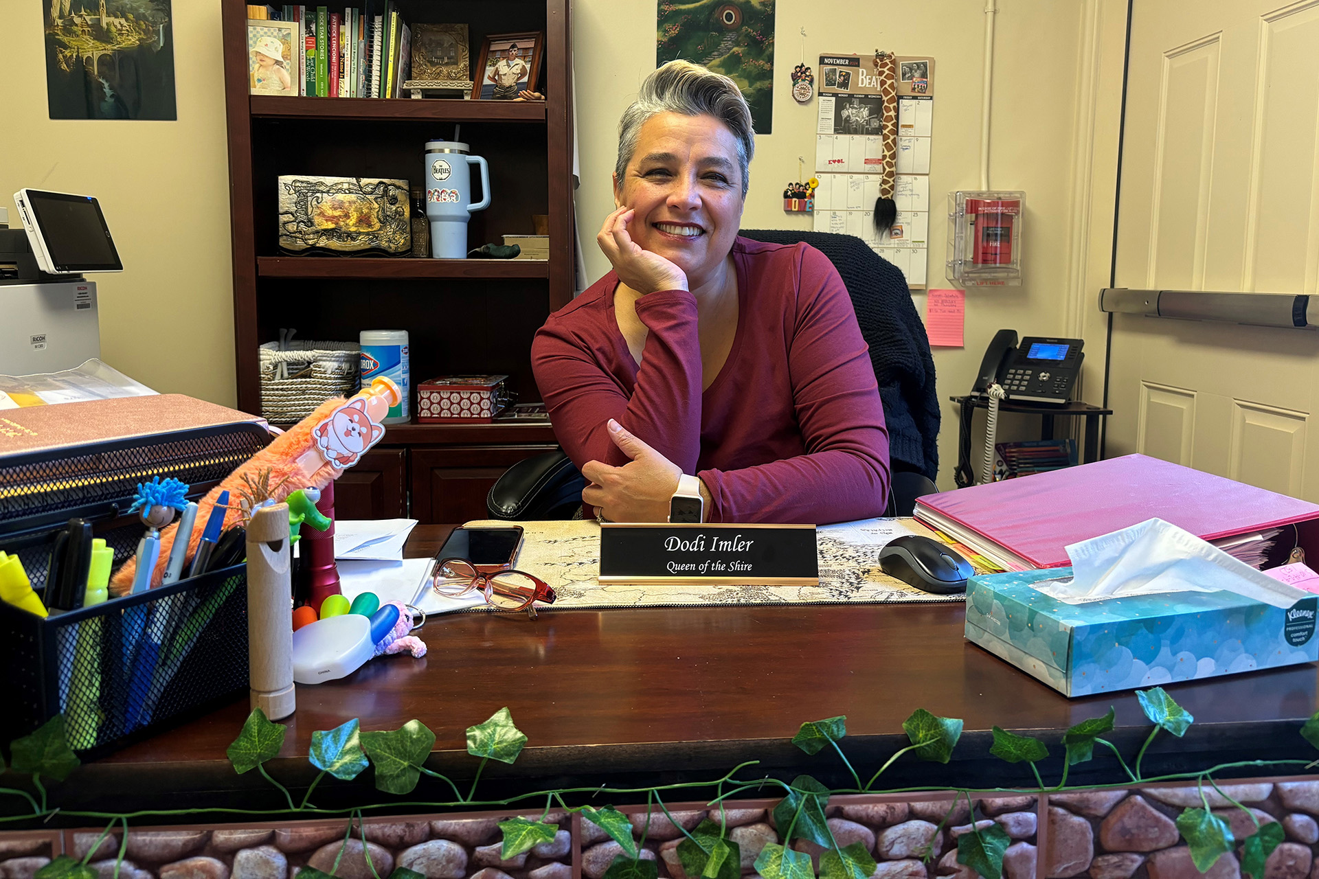 A child care administrator sitting at a desk