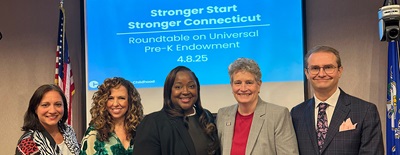Five men and women posing for a group shot at a Connecticut early childhood event