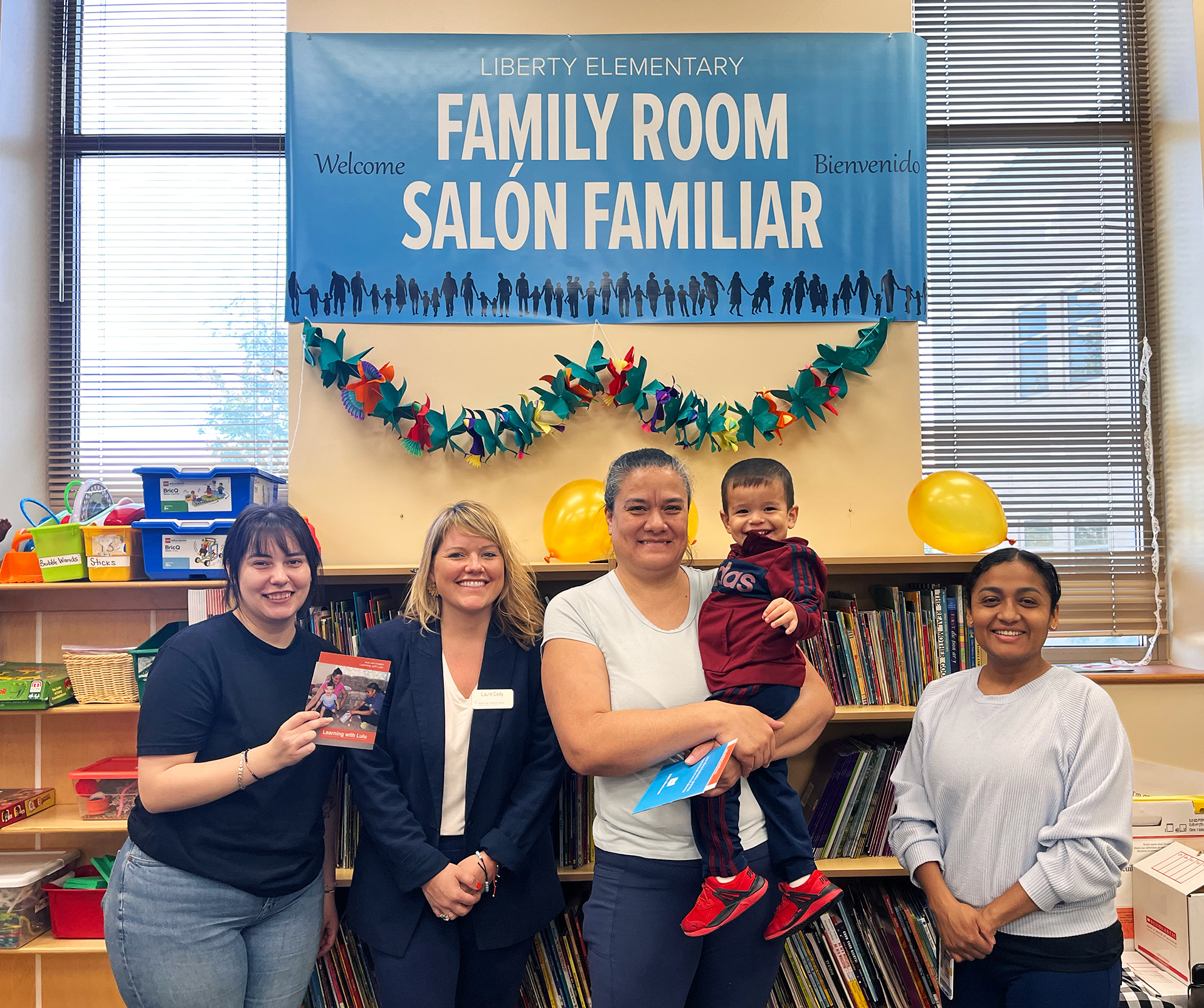 School staff and parents pose together at Liberty Elementary