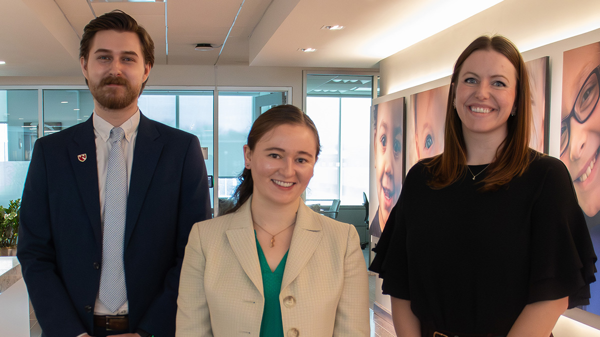 Group shot of three 2025-26 Graduate Scholars. From left to right: Colman Freel, Rebekah Rapoza, and Ali Shull