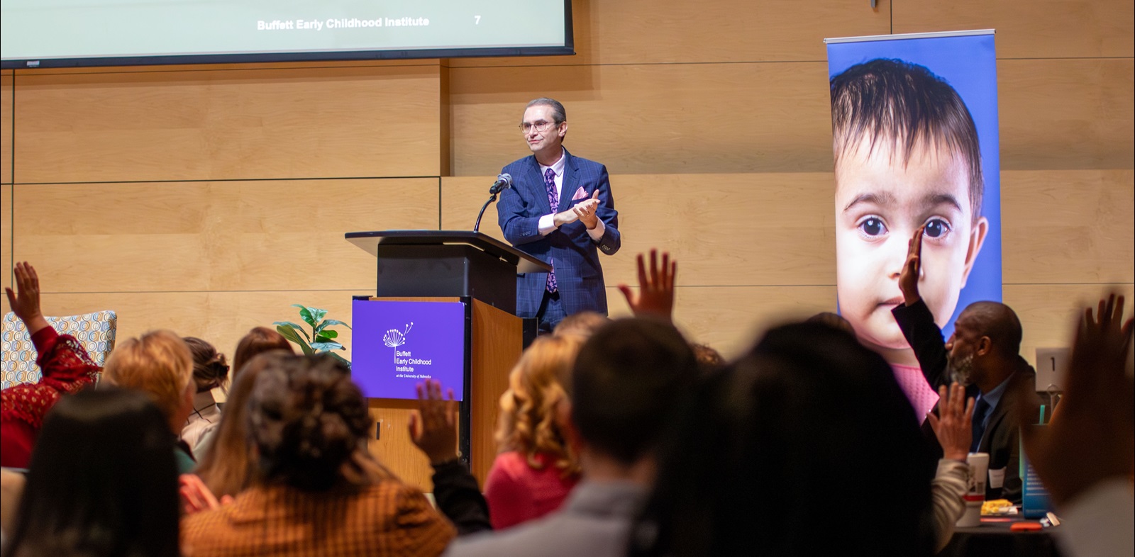 Walter Gilliam, the Buffett Early Childhood Institute's executive director, speaks at a podium at the 2026 Superintendents' Early Childhood Plan convening