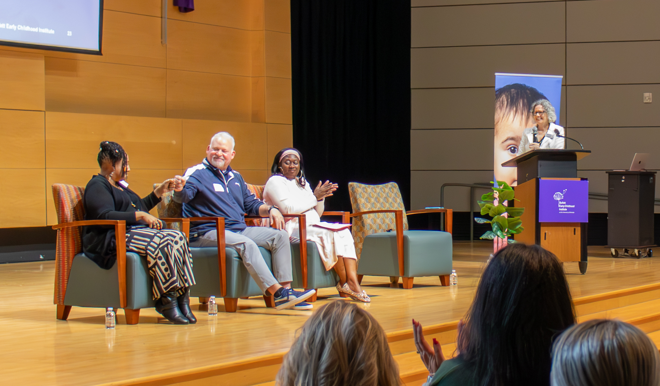 A panel discussion at the 2026 Superintendents' Early Childhood Plan convening featuring, seated, from left to right, Helen Evans, Joe Shimerdla, Tanishia Jacobs, and Amy Schmidtke standing at a podium