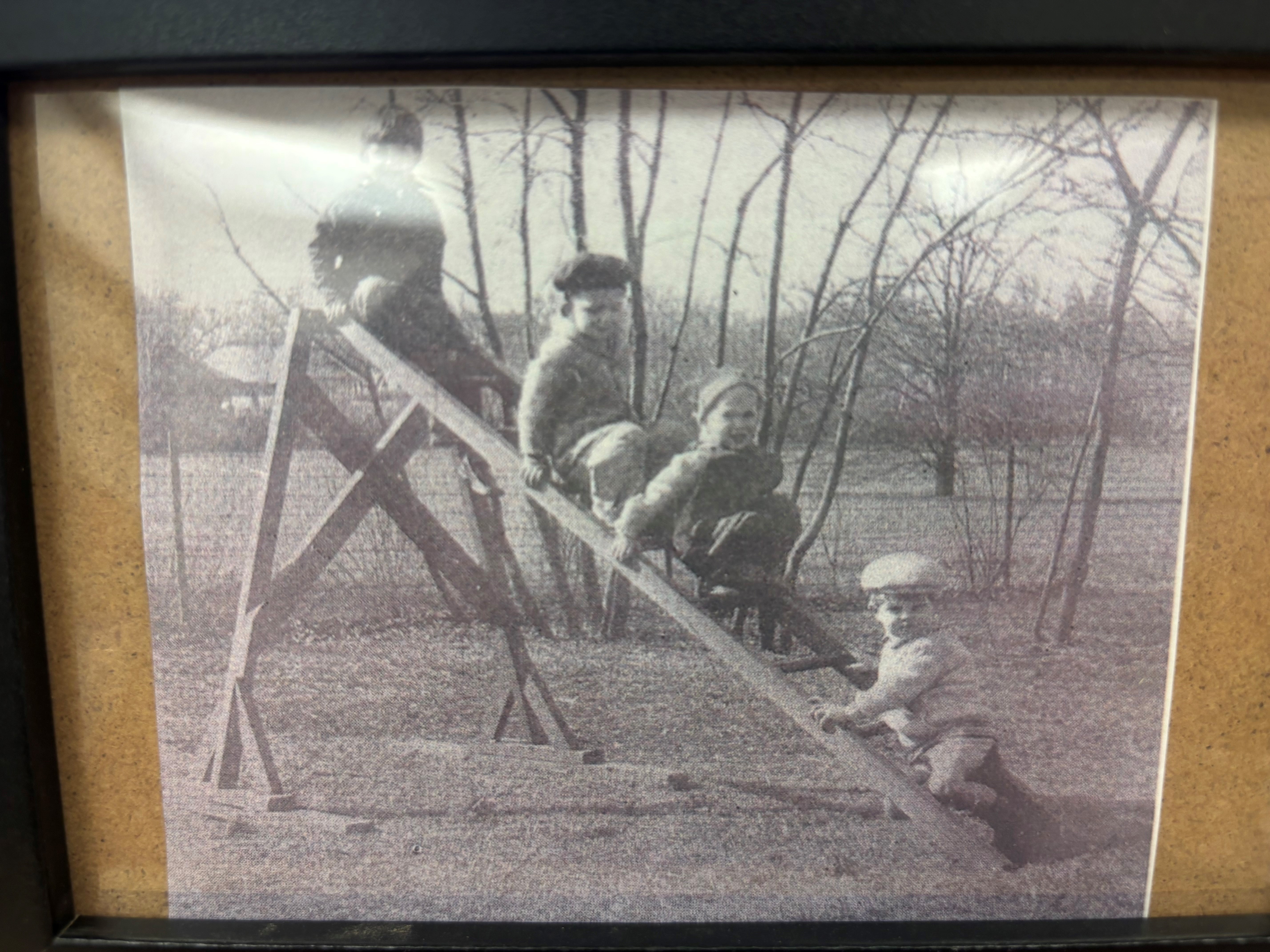 An old black-and-white photo of children playing outside the Ruth Staples Child Development Lab