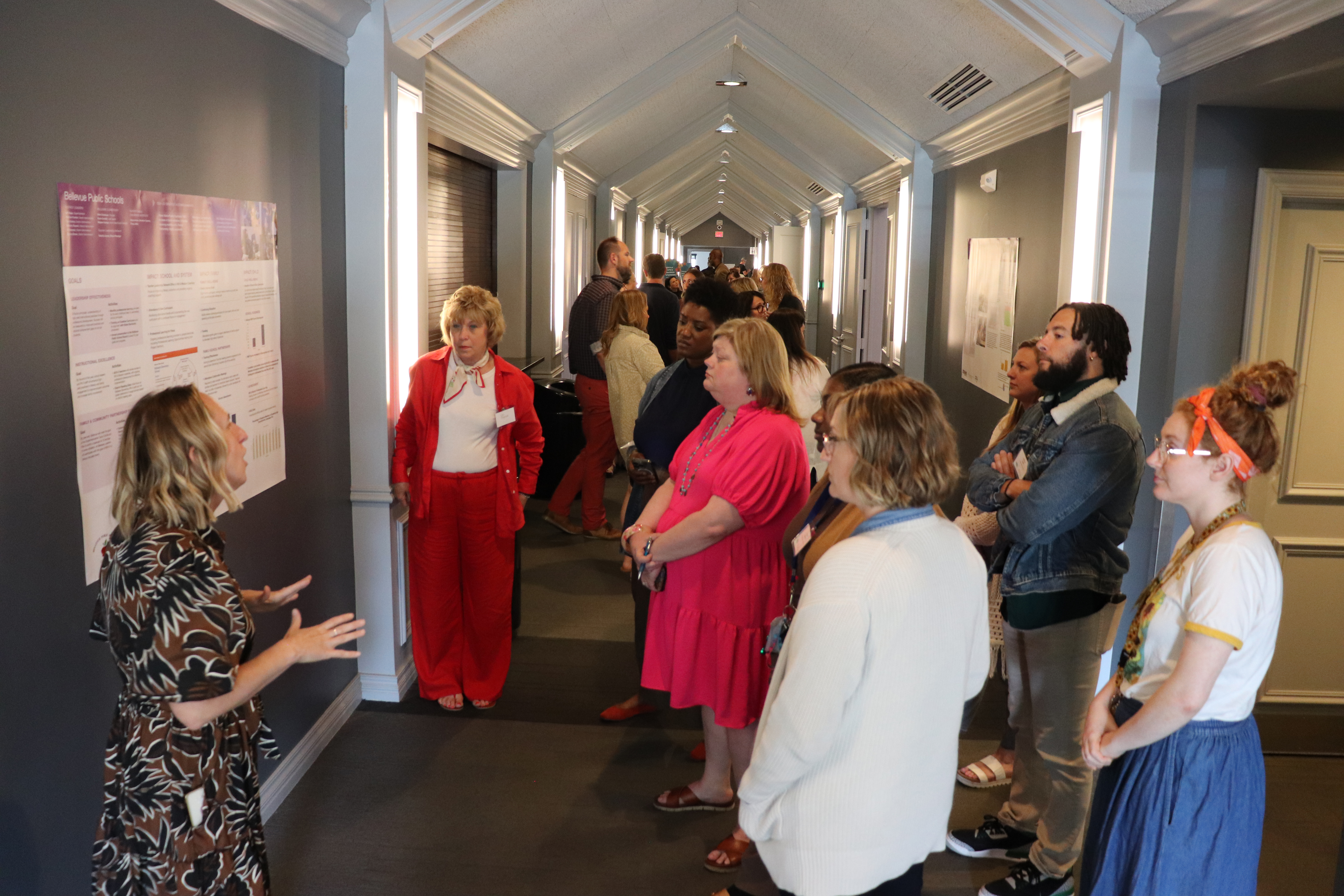 A crowded hallway during a data poster walk