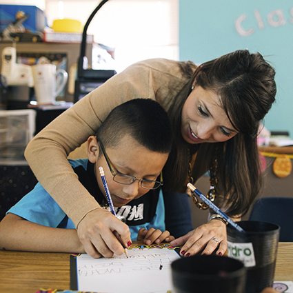 teacher helping student