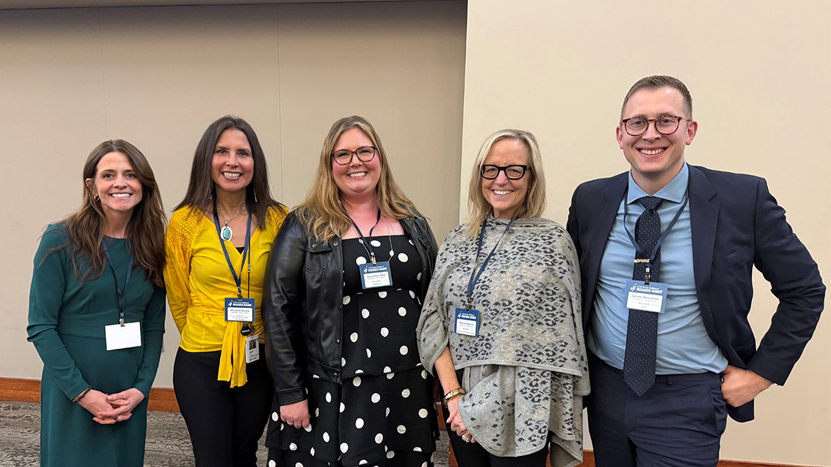 Five Buffett Early Childhood Institute staff members posing together at an event