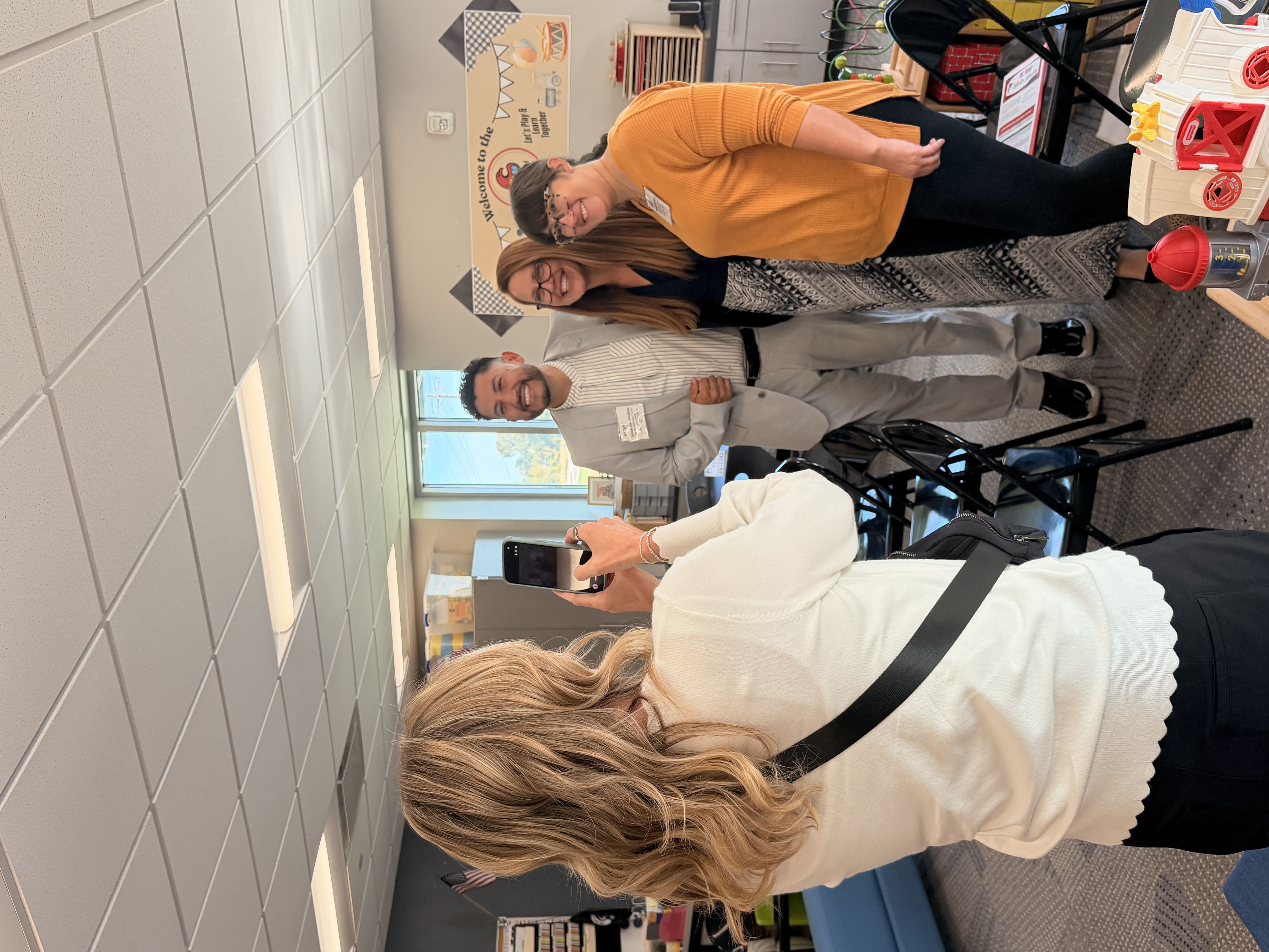 The Buffett Institute's Barb Stratman (center), poses with Josué Covarrubias from the Learning Community of Douglas and Sarpy Counties (left), and Micaela Dobbins from Omaha Public Schools (right). 